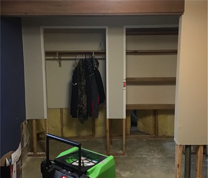 Two closets with no doors and trims, plus, the walls outside and inside closet are cut out at least 1 foot from the bottom.