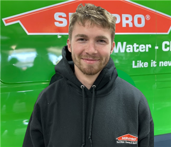 Jacob in front of SERVPRO vehicle 