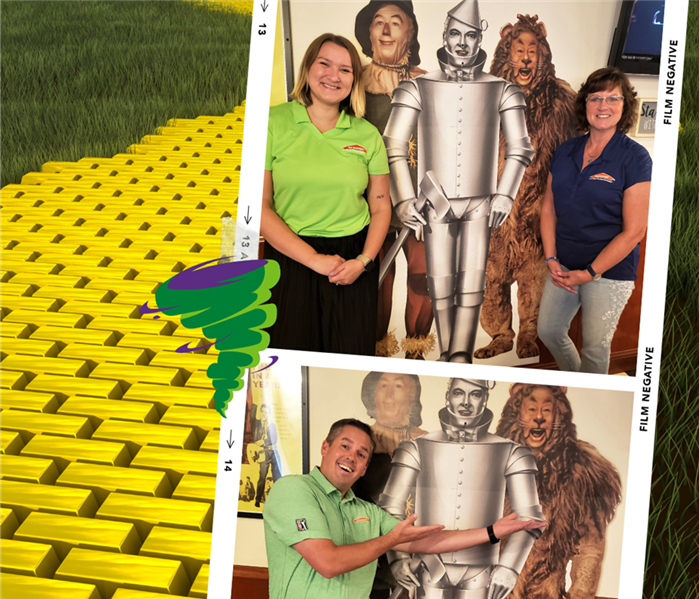 Yellow brick road backround with collage of SERVPRO employees by Wizard of Oz mural